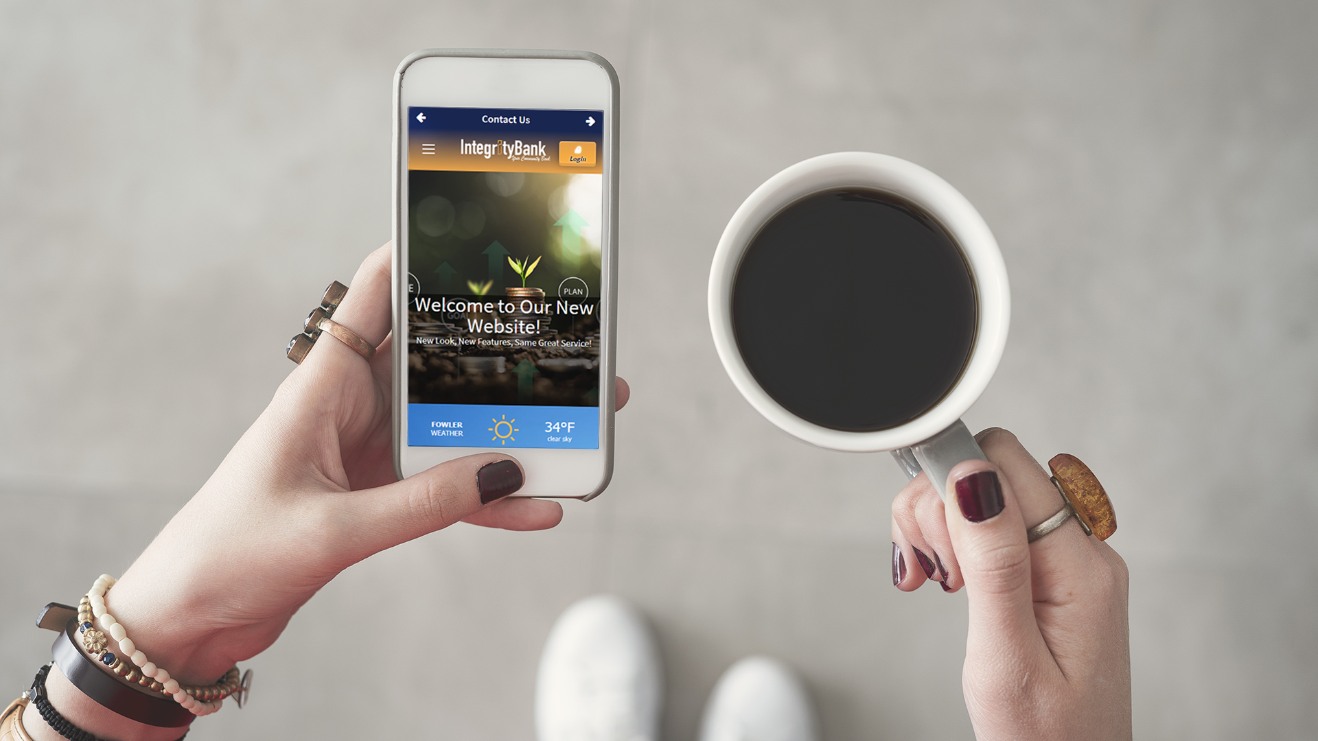 person holding cell phone and coffee